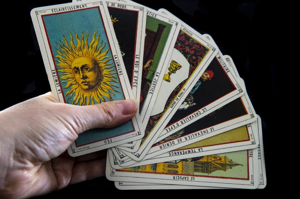 Holding Tarot Cards